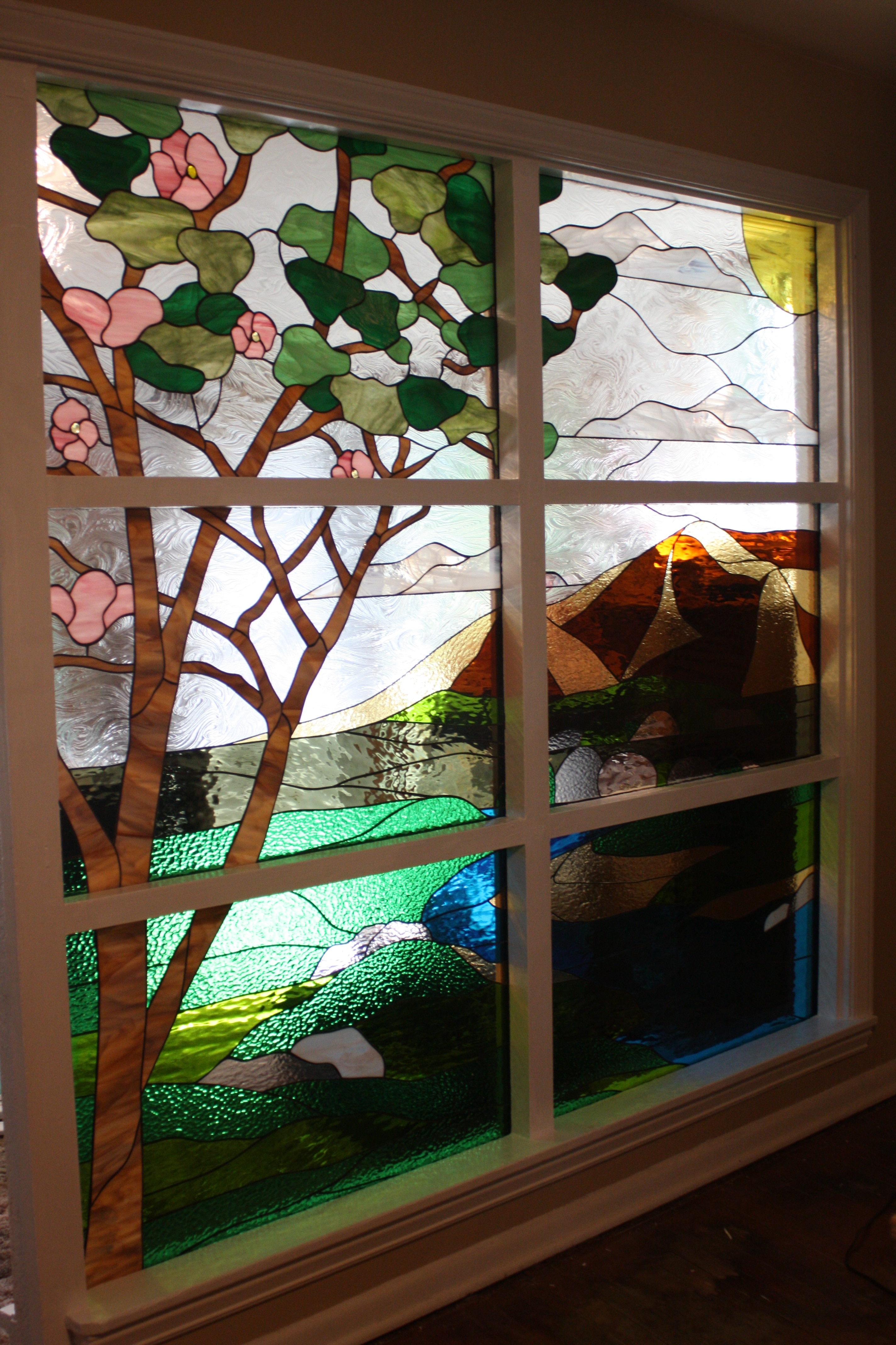 Six stained glass inserts deisgned into one scene