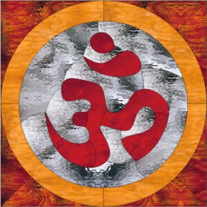 A circular stained glass panel featuring a vibrant red Om symbol set against a clear textured background, encircled by an amber glass border, with reddish-orange textured glass filling the corners.