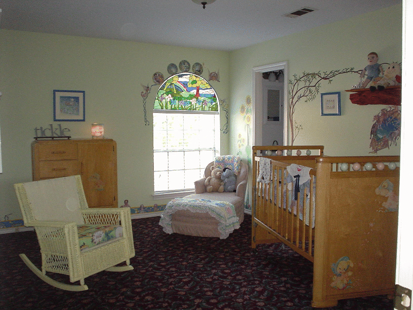Arched Iris & Rainbow window installed into a nursery