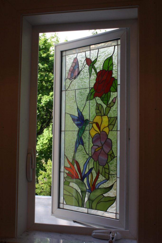 Triple paned Hummingbird & Flowers Stained Glass Window In A Crank Out Vinyl Frame