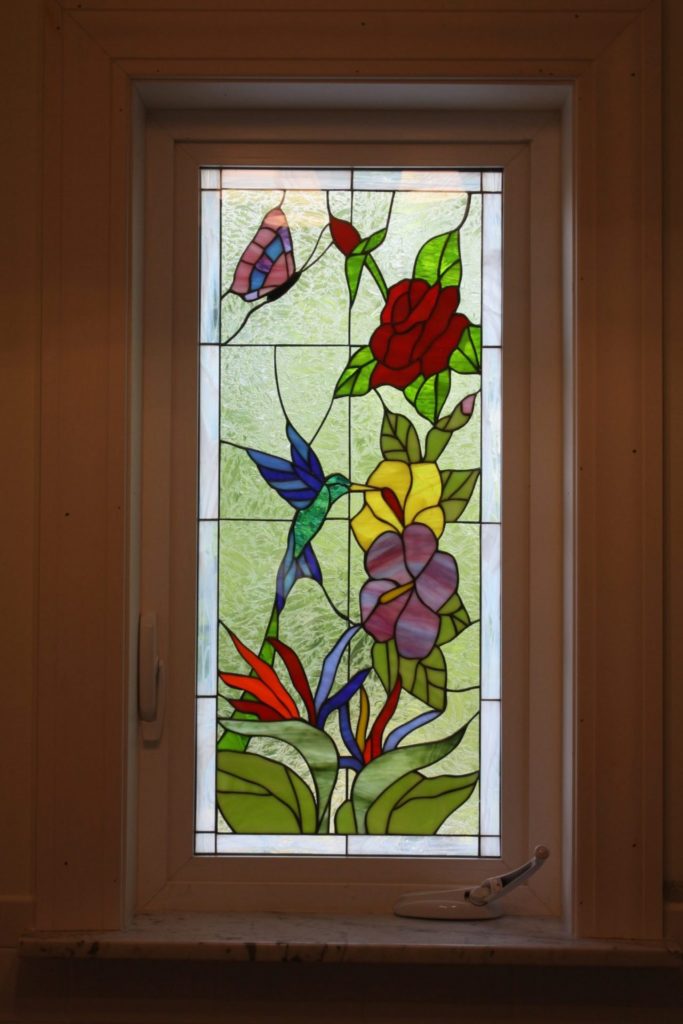 Triple paned Hummingbird & Flowers Stained Glass Window In A Crank Out Vinyl Frame