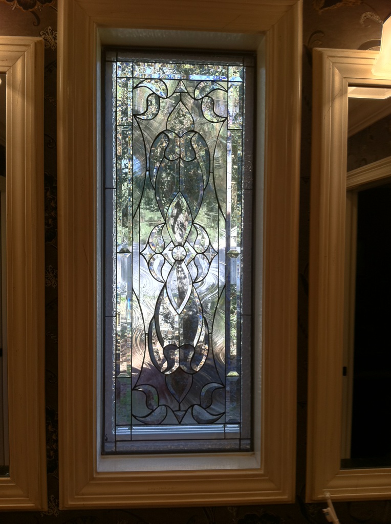 Tempered Triple Paned Beveled Glass Window Installed In A Wood Frame