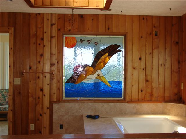 Pelican Stained Glass Window Minimally Installed Above Bathtub