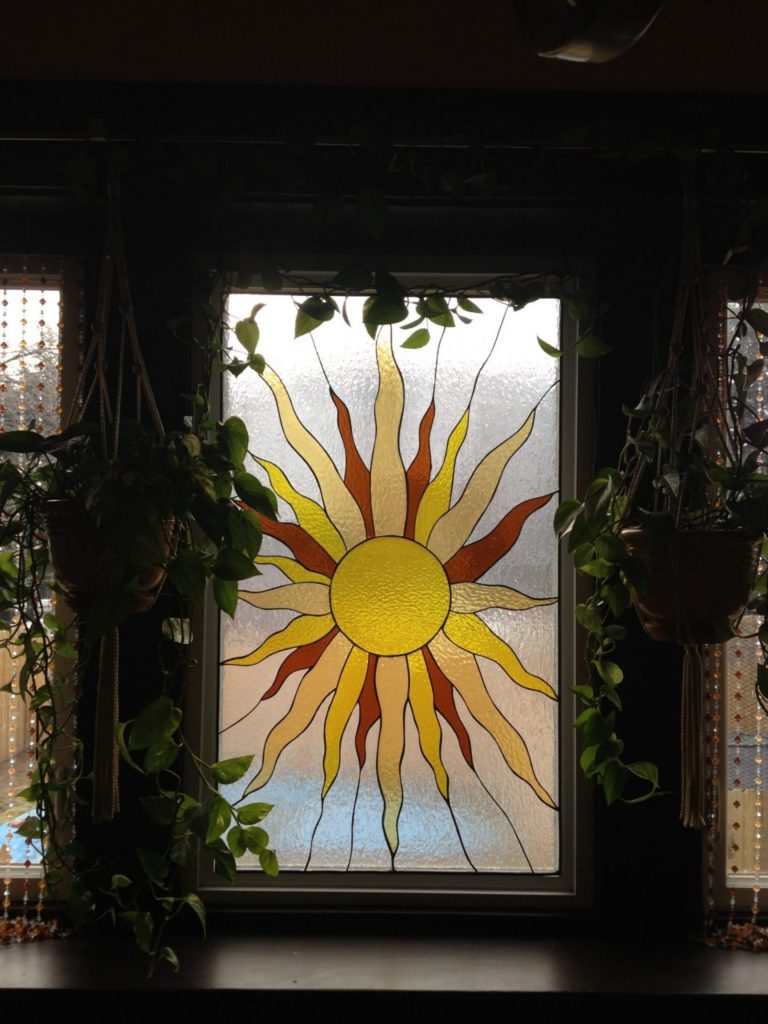 Stained Glass Sunburst Simply Set Against An Existing Window Pane