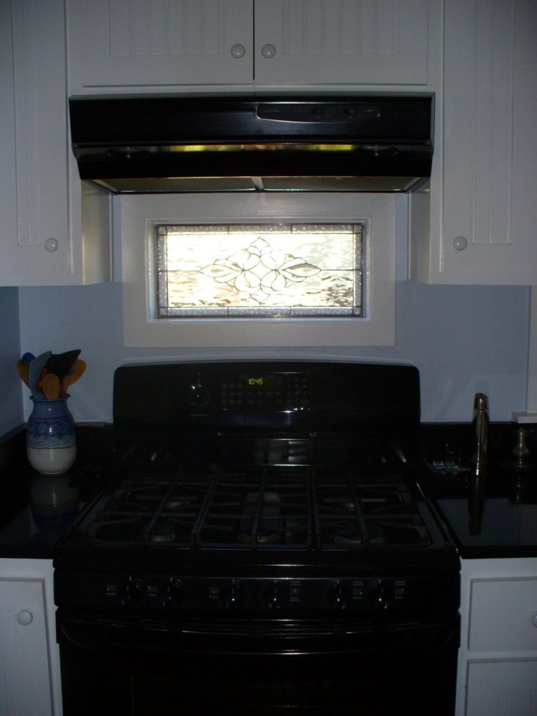 Classic Beveled Window set against an existing window for an installed above a Stove