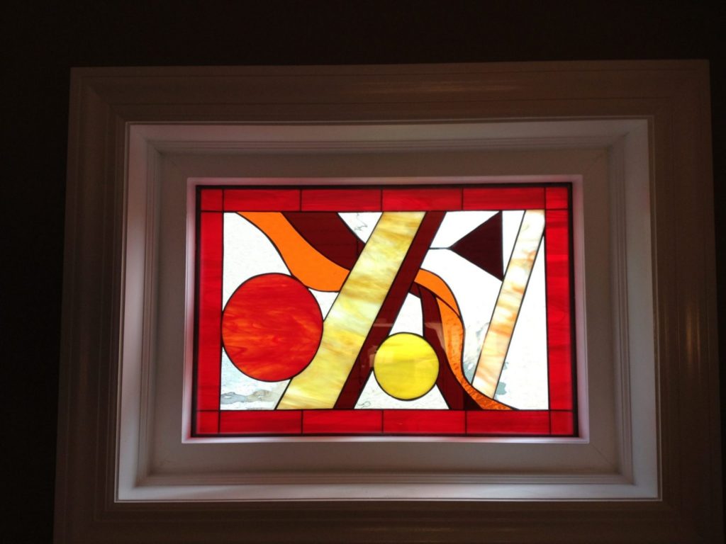 Abstract Stained Glass Window Installed In A Vinyl Frame