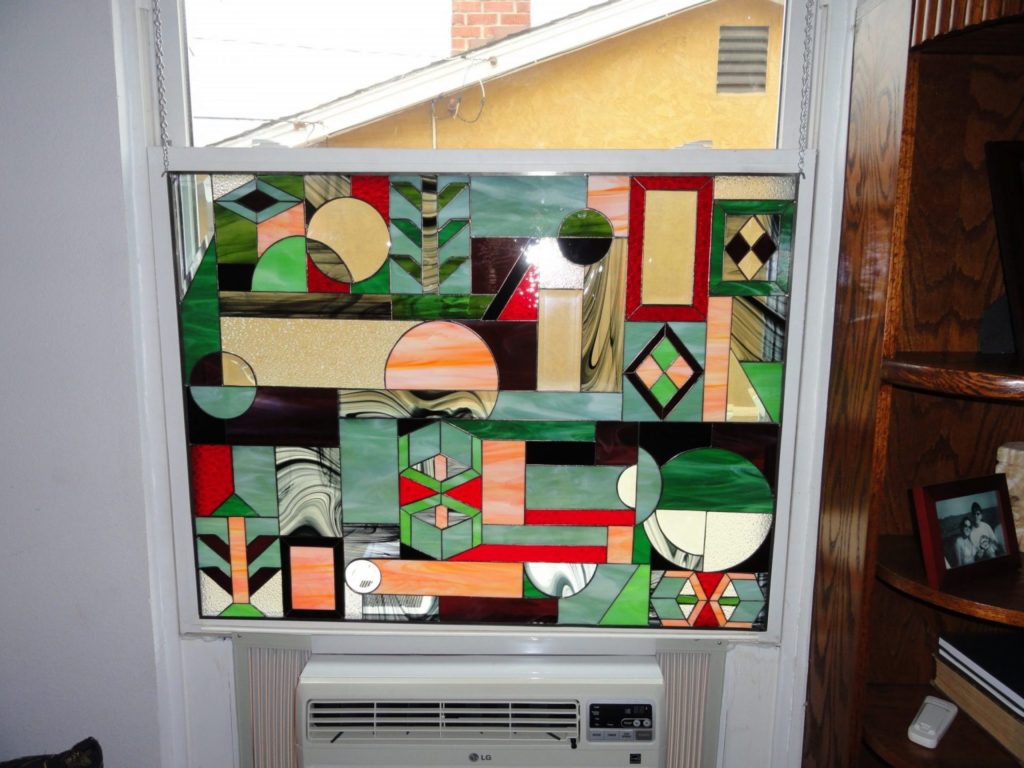 Stained Glass Window Installed Above Air Conditioning Unit