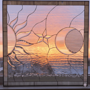 A rectangular leaded glass window panel depicting a stylized celestial scene. On the left is a partial sun with beveled rays, in the center is a beveled star, and on the right is a crescent moon. The design is crafted from various clear, textured, and beveled glasses.