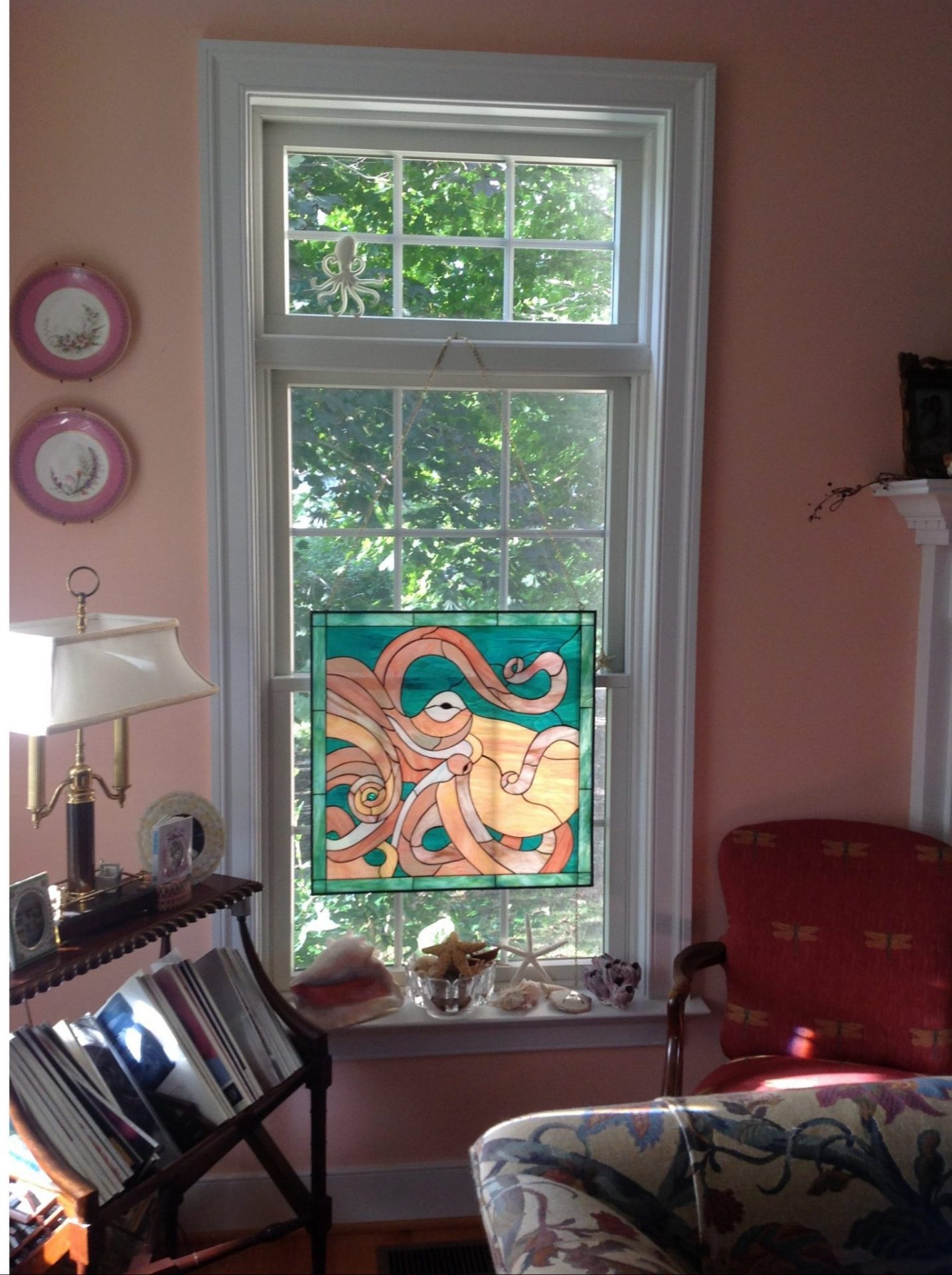 All original Octopus stained glass window hung with chains and hooks