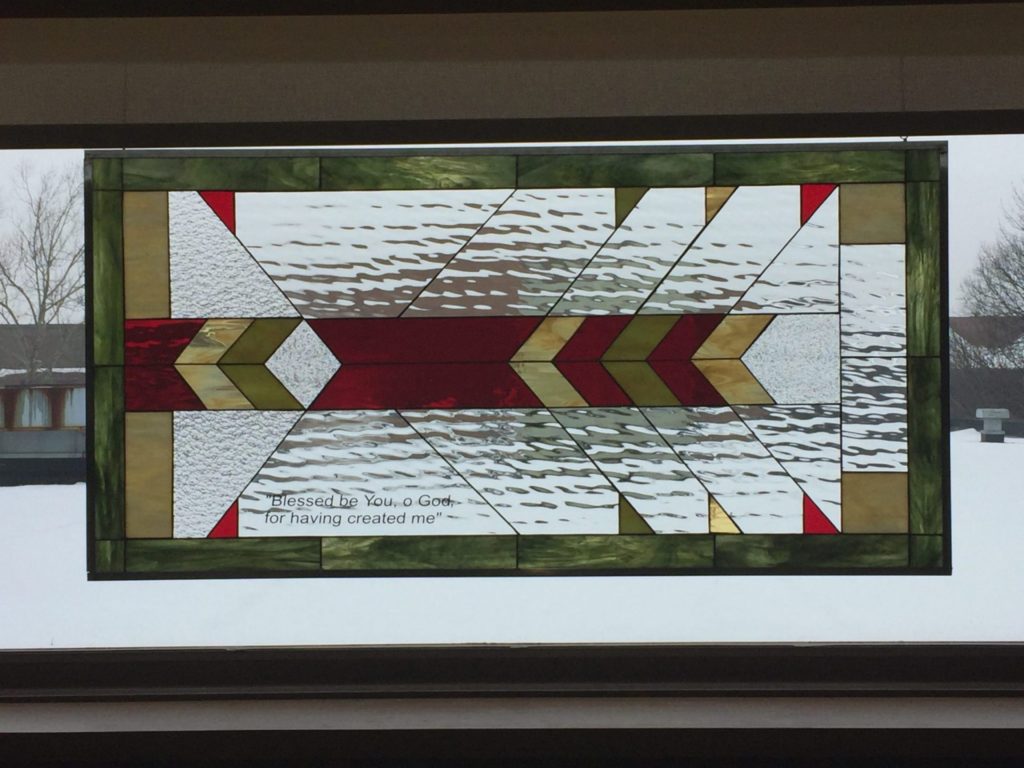 Stained glass windows hung in a Church