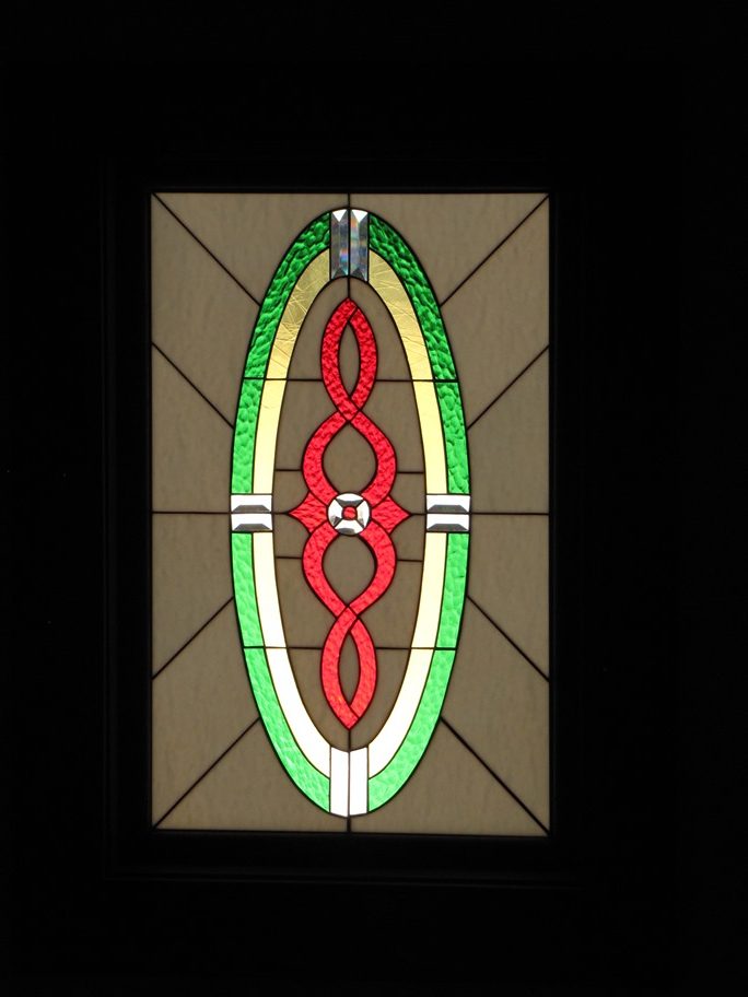 Stained Glass window installed above an entryway