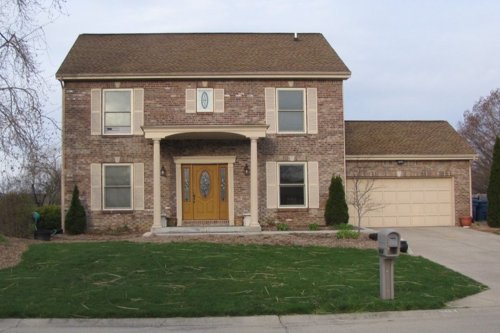 Curb appeal! Lovely stained glass window installed above an entryway