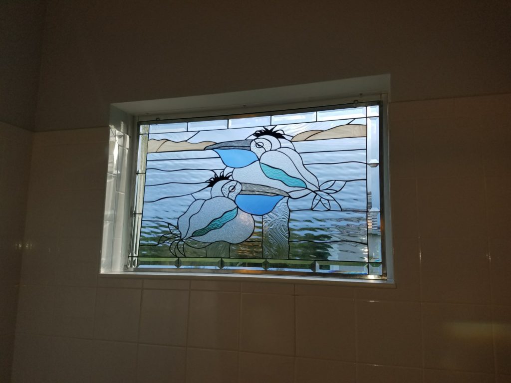 Lazy Pelicans Single Pane Window Set Against Existing Glass In Shower Area