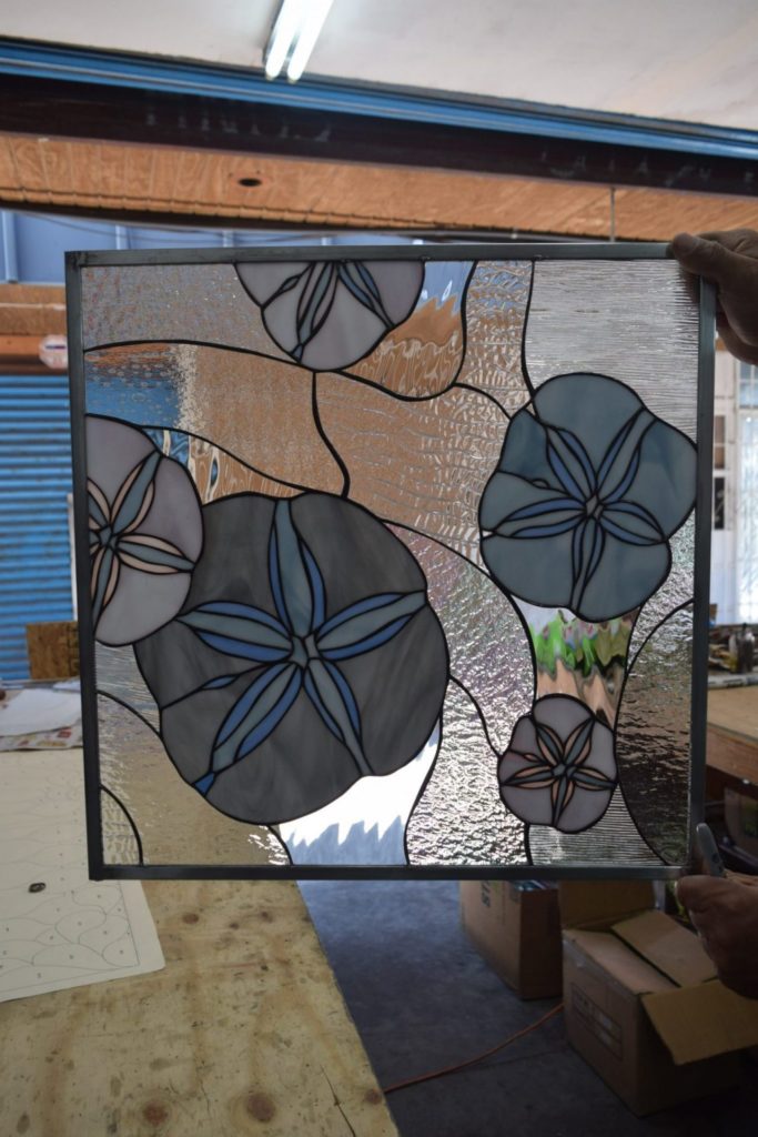 A Pair Of Sand Dollar Window Inserts Installed In A Beach House On The East Coast
