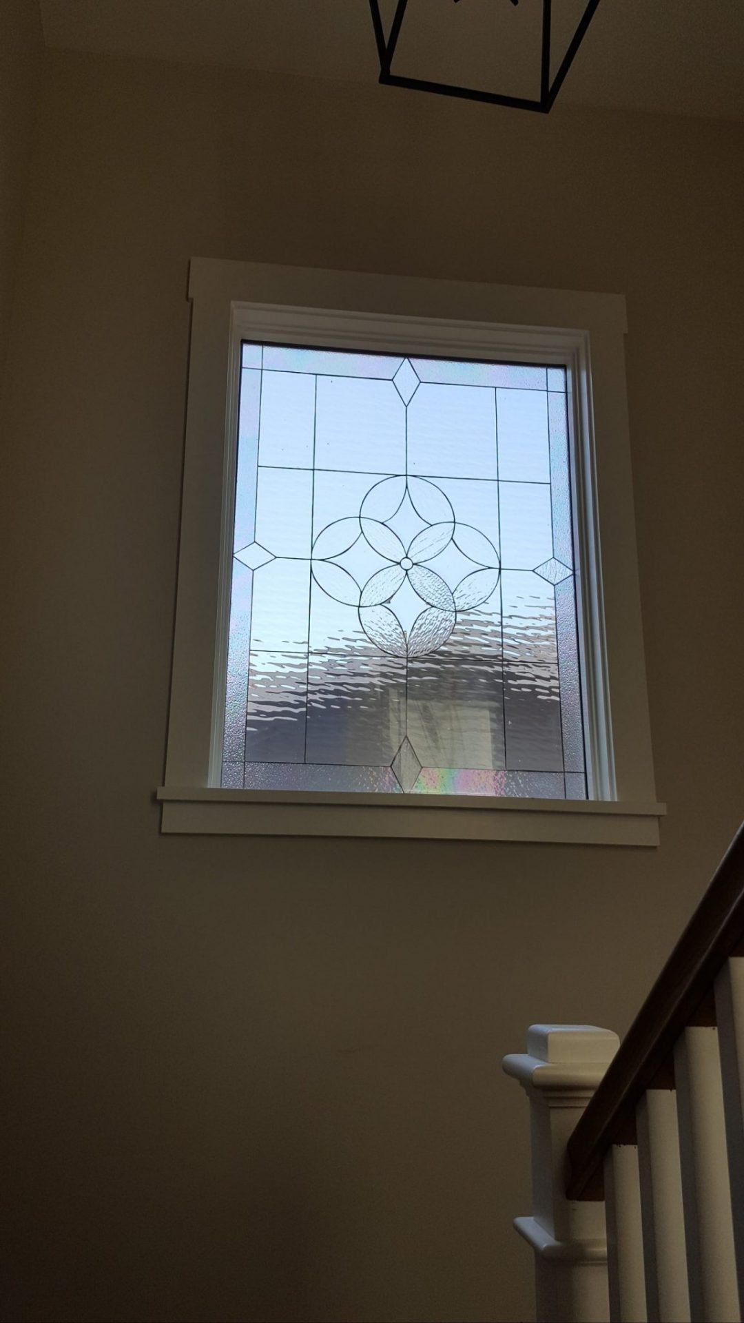 A Large Beveled All Clear Window Installed On A Staircase Landing