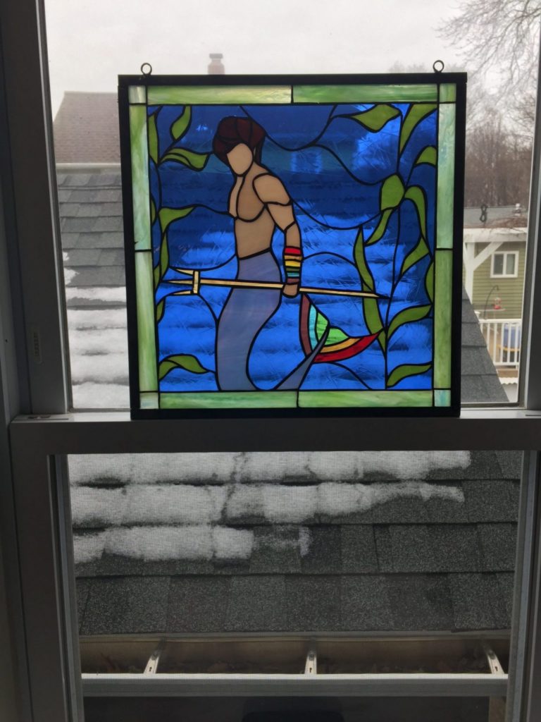 Merman Stained Glass Panel Suspended in a Window With Chains