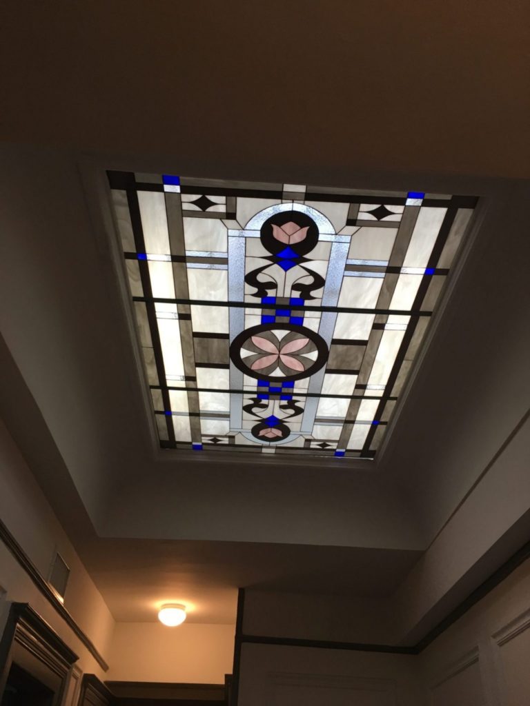Wow! Large skylight insulated in clear tempered glass above a stairway