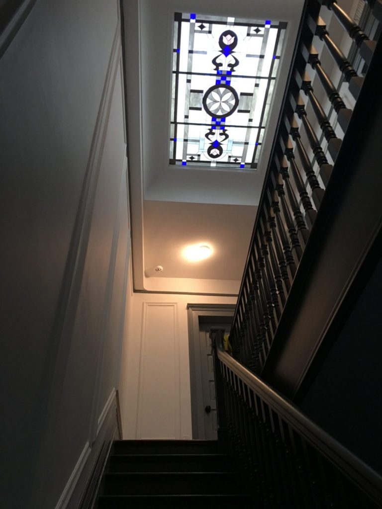 Large skylight insulated in clear tempered glass above a stairway