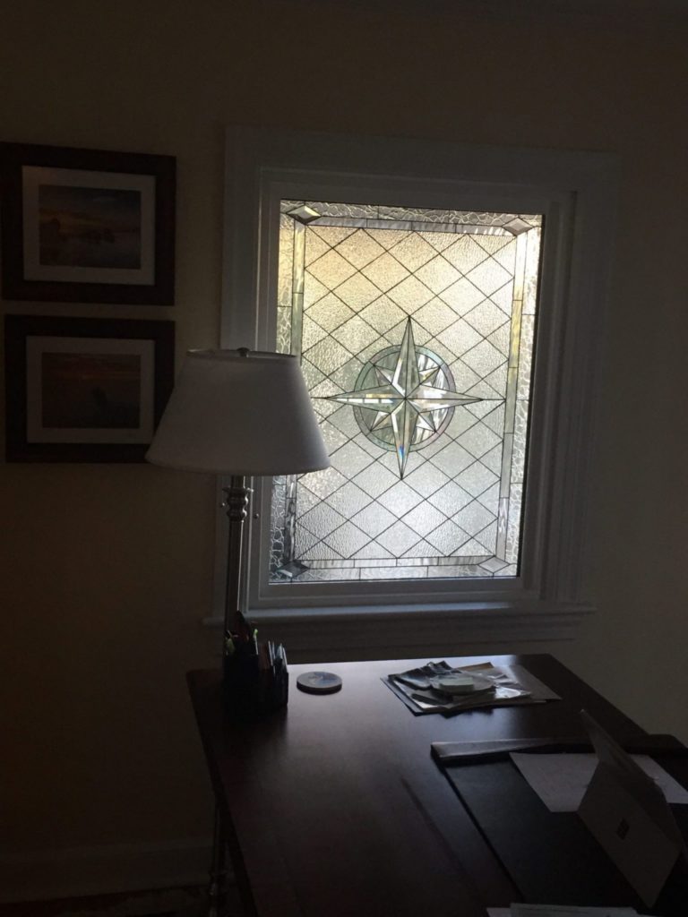 Beautiful Compass Rose Beveled Window Installed In A Home Office