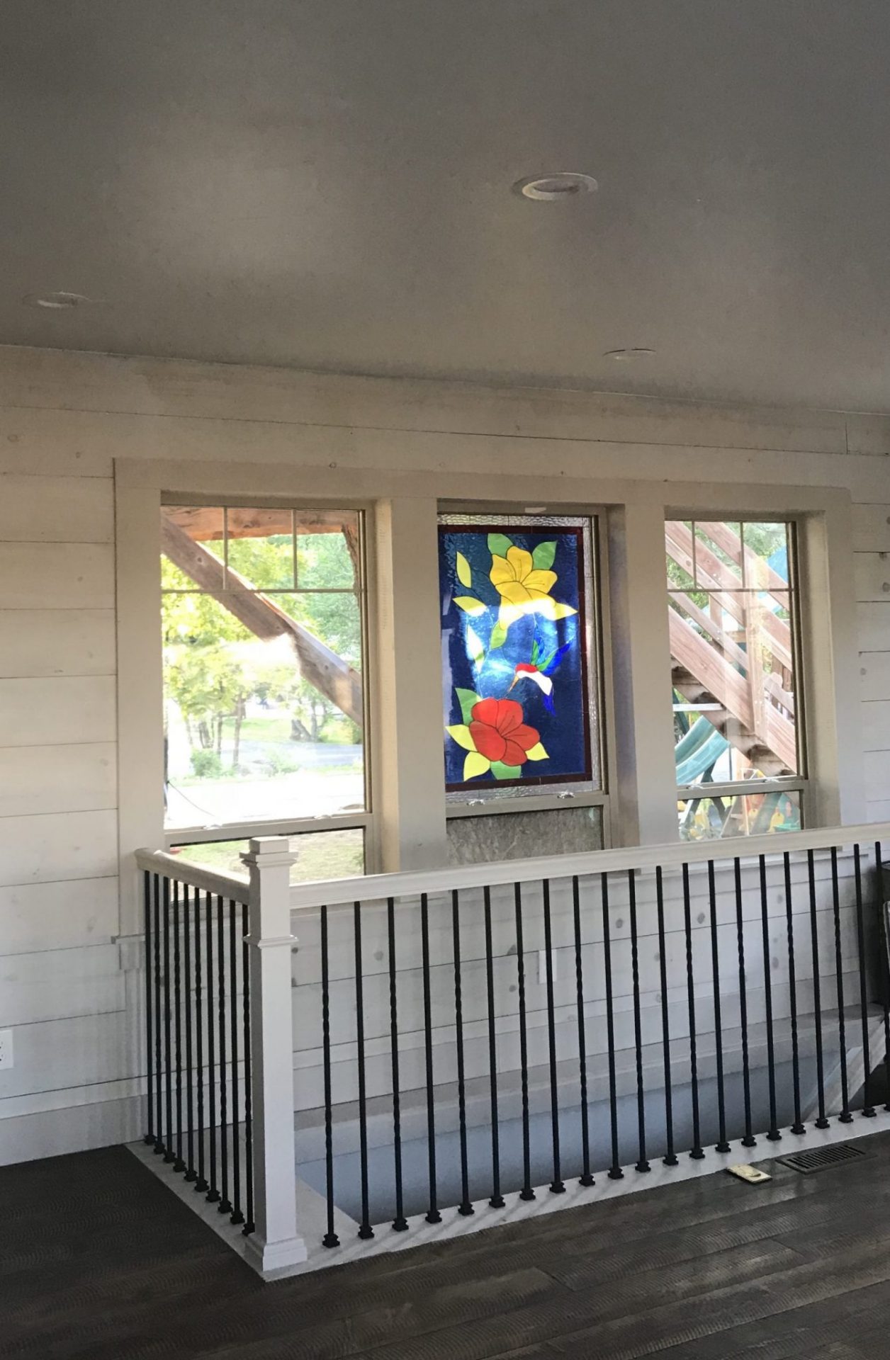 Beautiful Hummingbird & Flower Window Installed Above Stairway