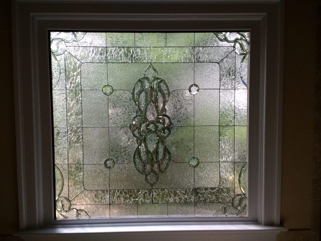 Magnificent beveled and clear textured glass window