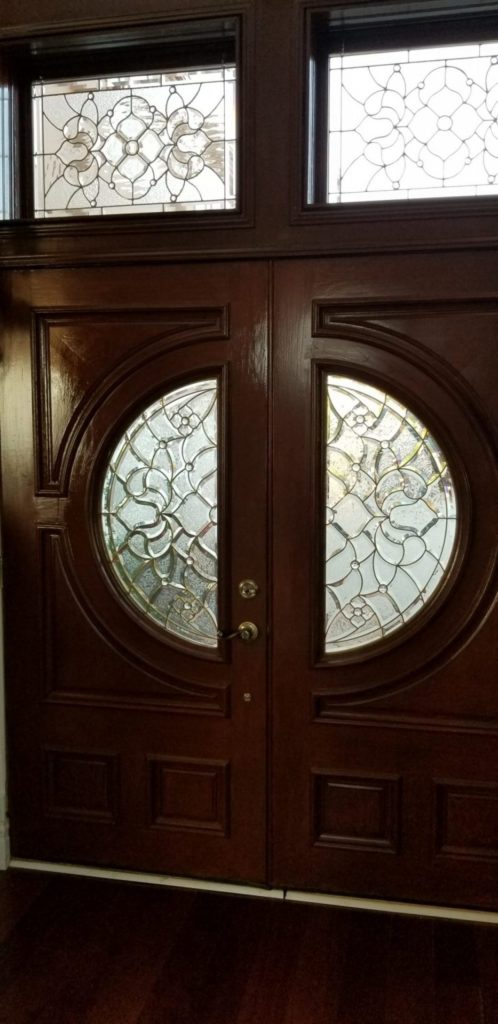 Victorian style brass came beveled windows made for a clients entryway
