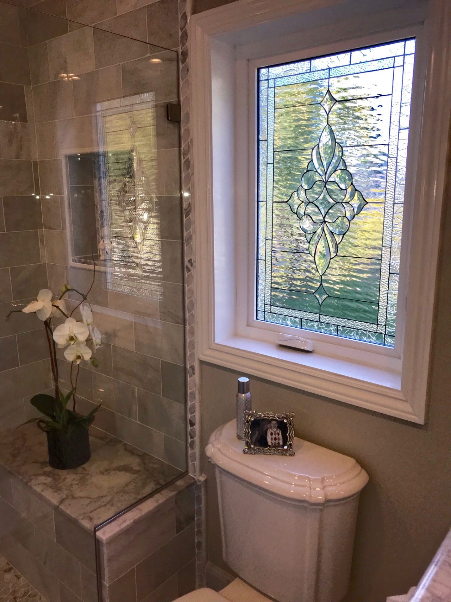Stunning all clear beveled window installed in bathroom for privacy, light and beauty