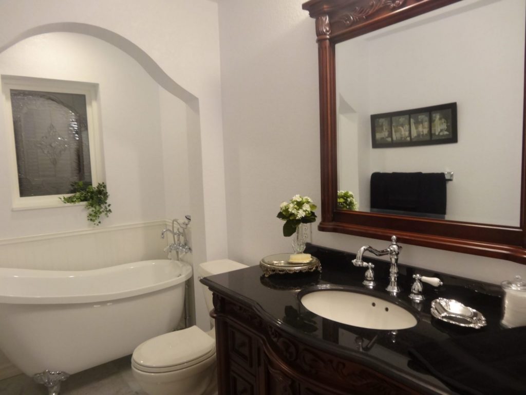 A beveled leaded artglass window installed over bathtub