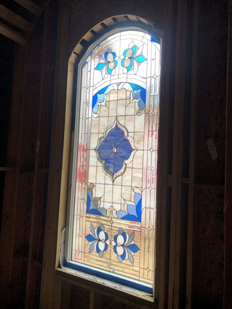Breathtaking Arched beveled window installed for new construction