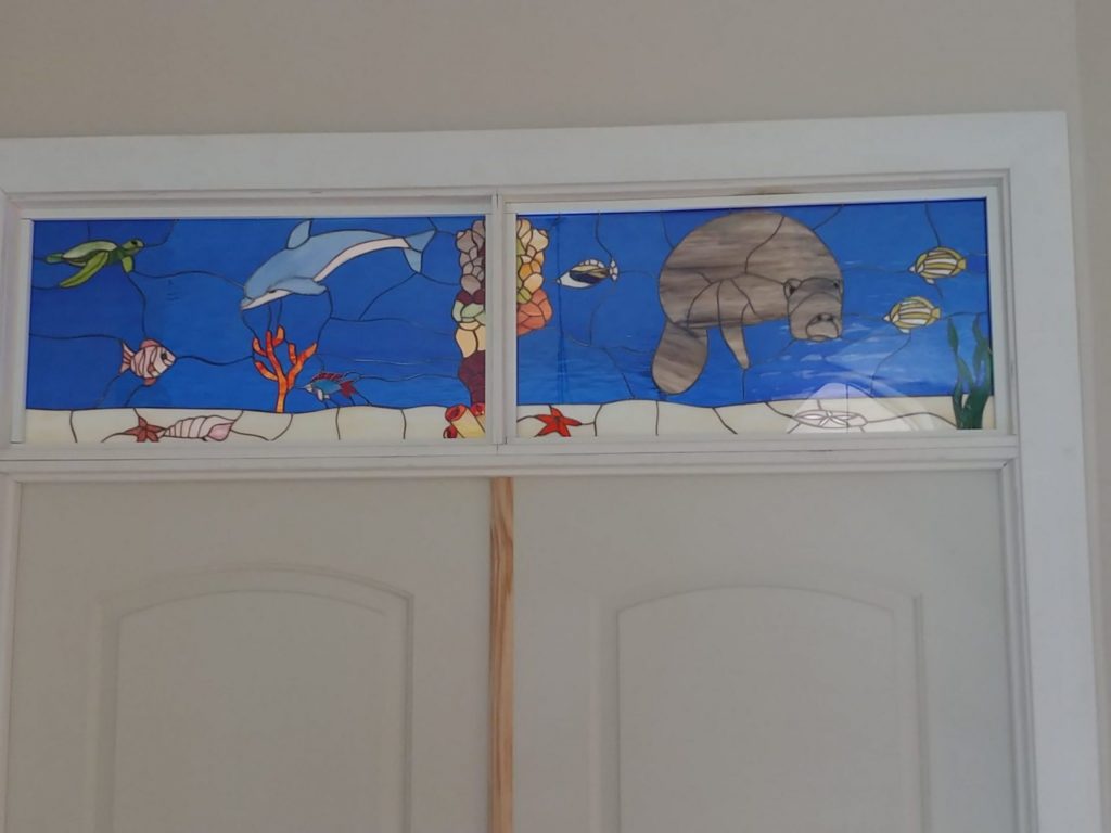 Two Sealife Transom Windows Installed Over front Doors In A Home In Florida