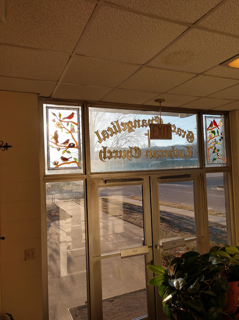 Two stained glass bird & flowers panels made for each side of a transom in a Church entryway