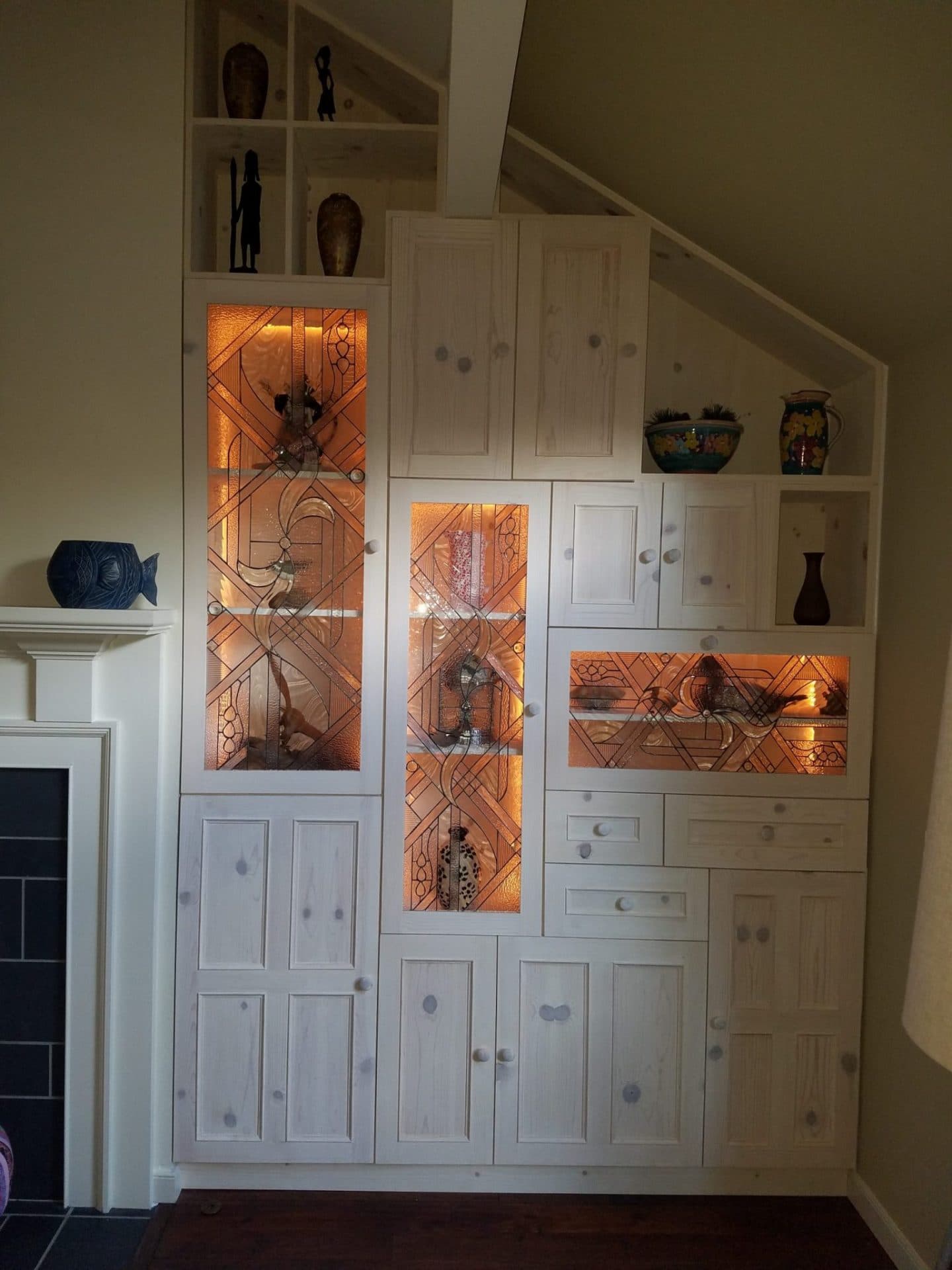 Stained glass beveled cabinet inserts installed with LED lighting
