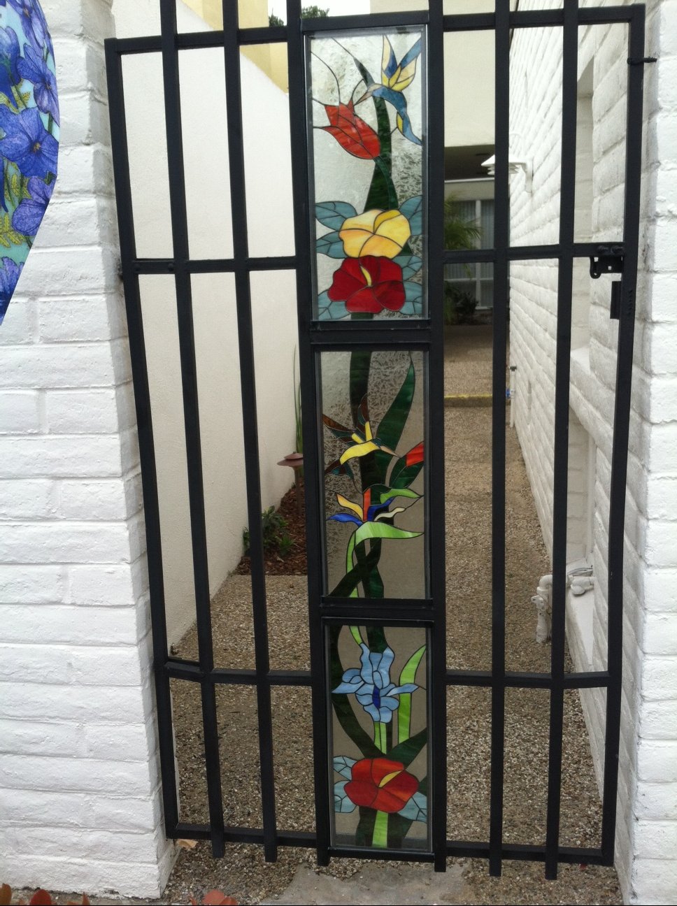 Triple-paned stained glass Hummingbird and Flowers fence inserts