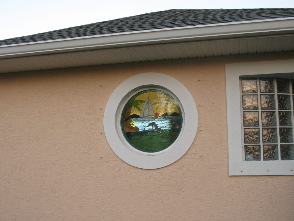Circular Stained Glass Window Installed Into A Frame