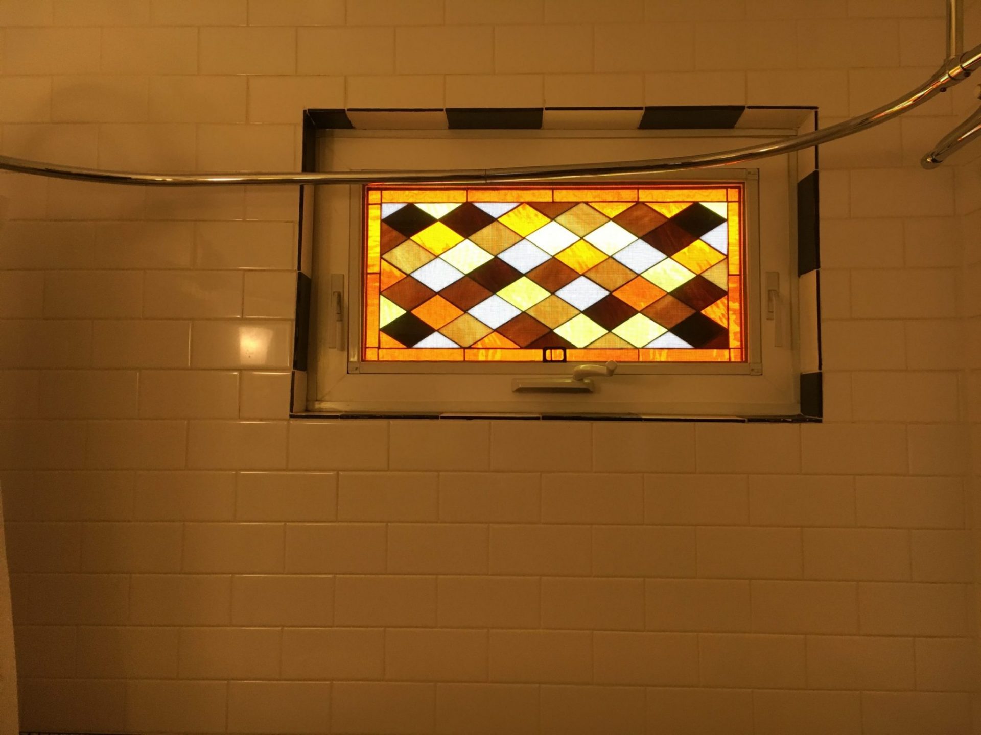 Triple Paned Diamond Window In A Bathroom Shower