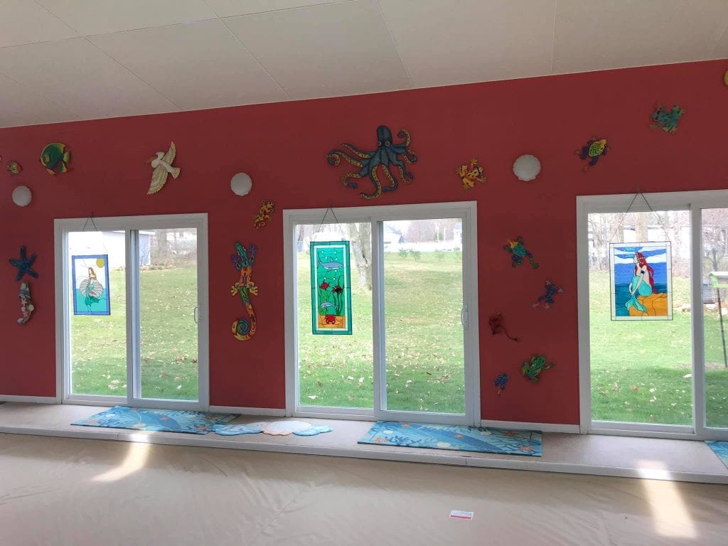 Multiple Ocean Theme Stained Glass Window Panels Hung By Hooks and Chain