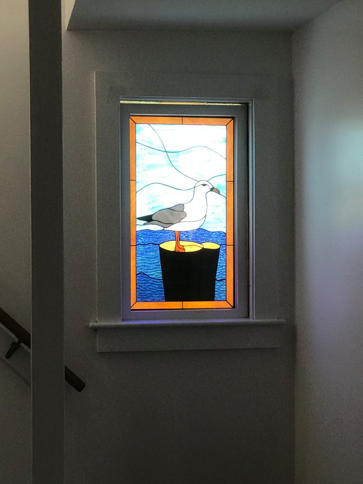 Seagull & Ocean Stained Glass Windows Installed On A Stairwell Landing