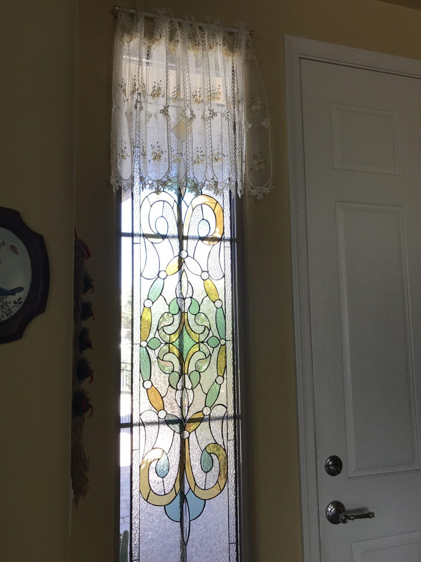 Victorian Stained Glass Window Set Against Existing Window With Grid System