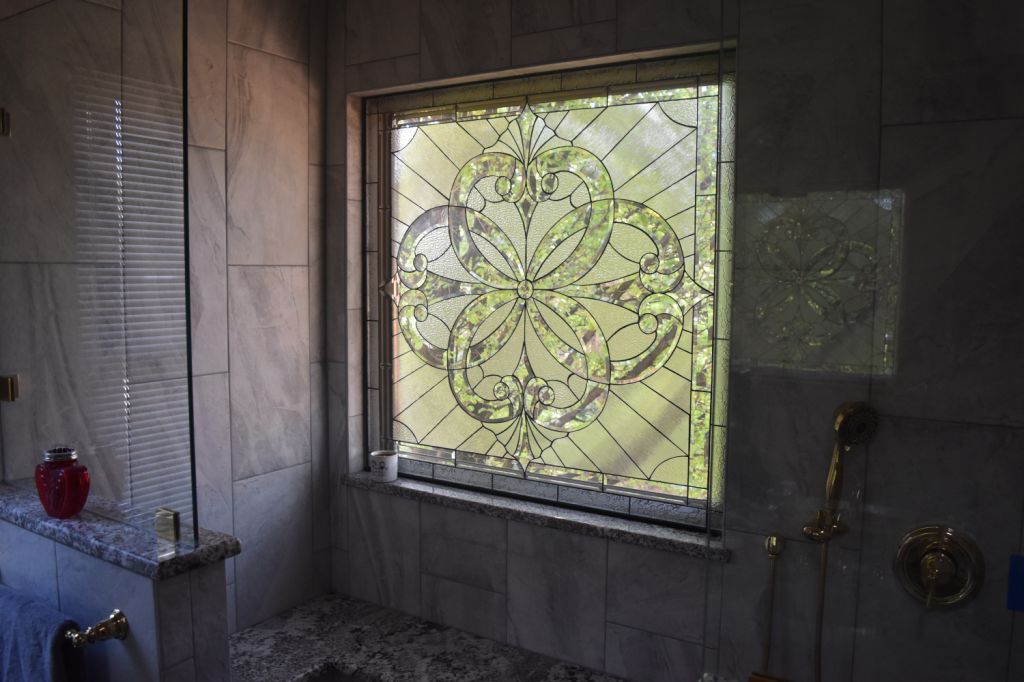 Beveled Stained Glass Window Installed Over A Bathtub