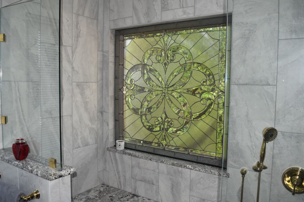 Heavily Beveled Stained Glass Window Installed Over A Bathtub