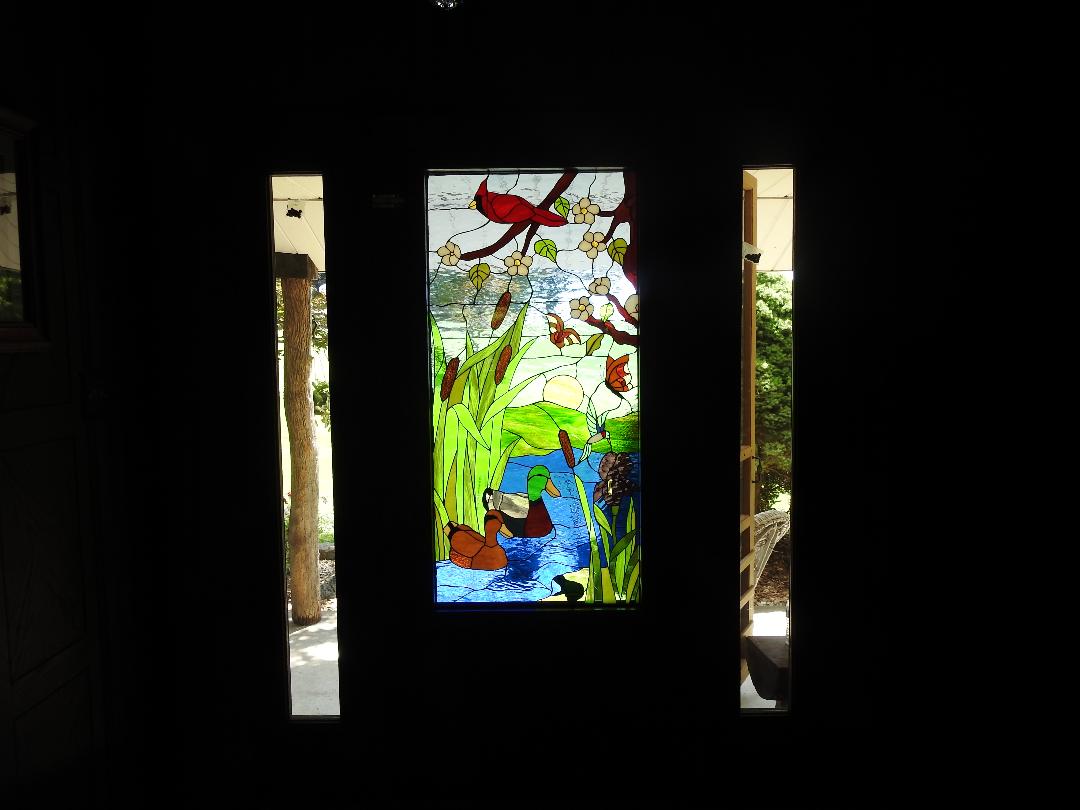 Bird & Duck Fantasy Window Installed In A Entry Way Door