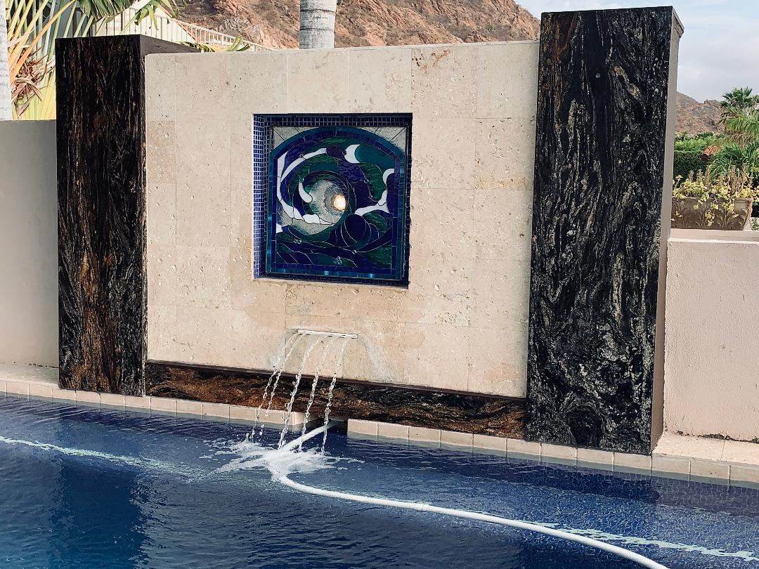 Pool Side Water Feature Filled In With A Cresting Wave Stained Glass Panel