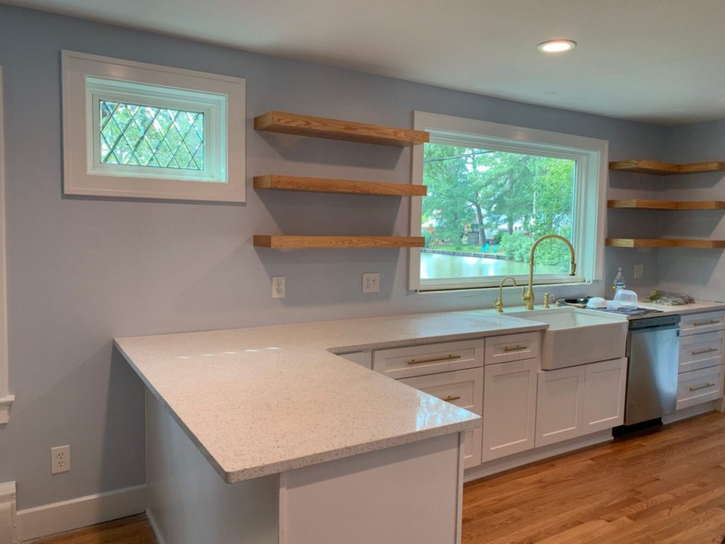 Tudor Style Beveled Diamonds Windows Used In A Kitchen Area