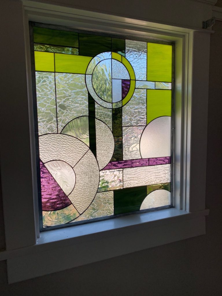 Colored geometric Stained Glass Window Installed In A Living Room