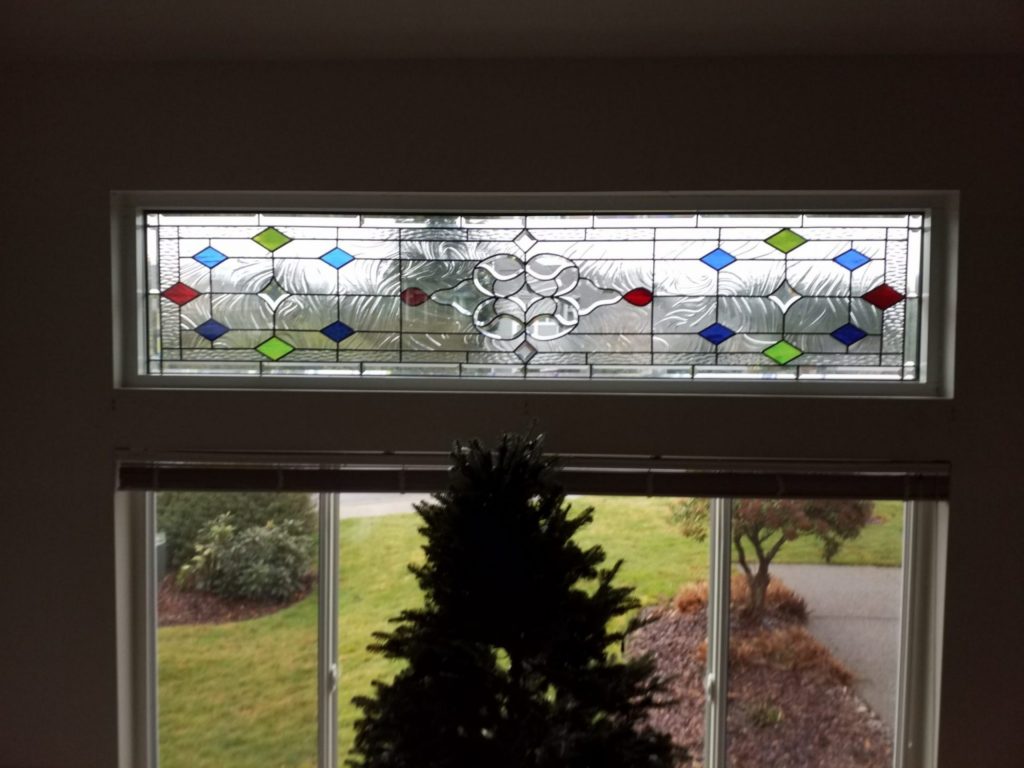 Classic Beveled Victorian Style Window Installed As A Transom Window