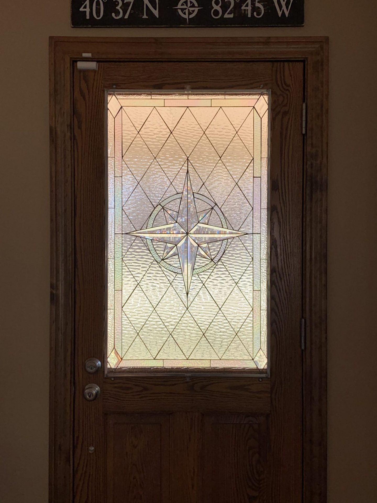 Stained Glass Beveled Compass Rose Installed In A Front Door