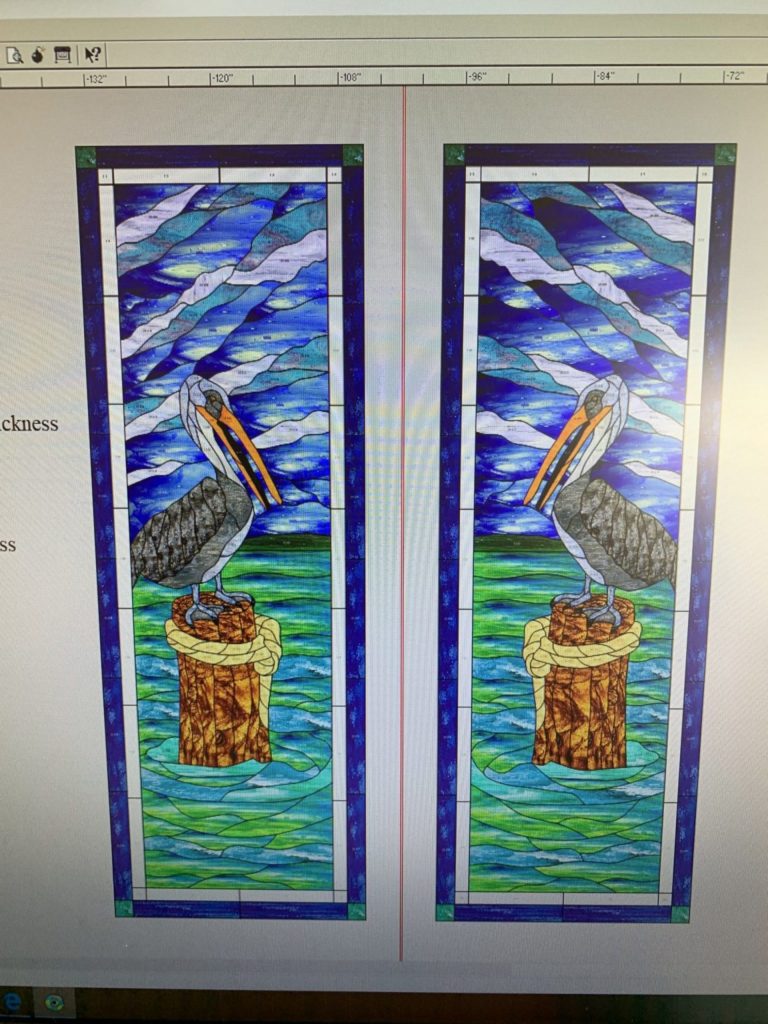 Two symmetrical rectangular stained glass panels, each depicting a grey pelican with an orange beak perched on a brown weathered wooden piling. The piling is encircled by a yellow-beige rope. The background features a vibrant seascape with deep blue and teal wavy sky textures above, and undulating green and blue water patterns below. Each panel is framed with a deep blue border, showcasing a leaded glass style.
