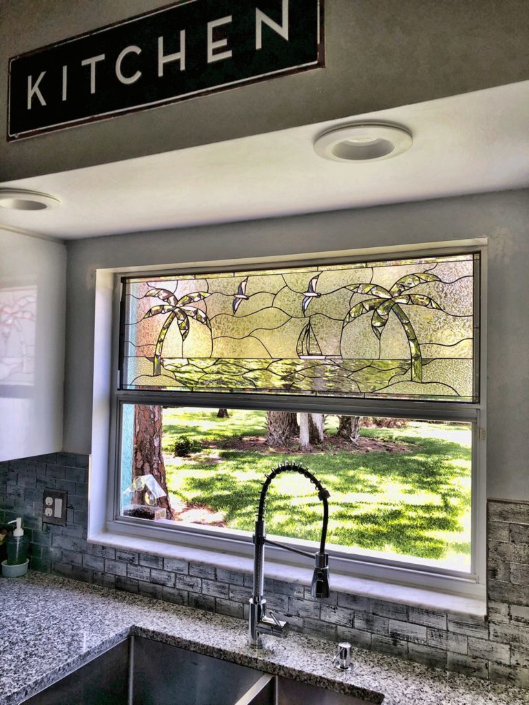 Beveled Palm Tree Beach & Sailboat Stained Glass installed in a Kitchen