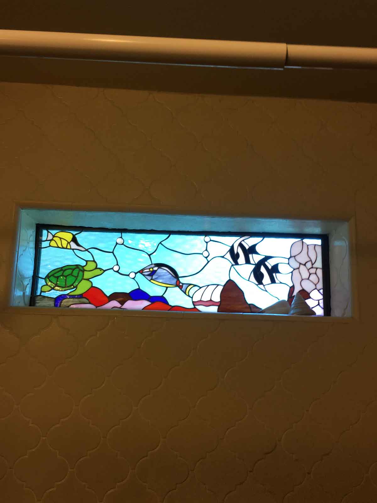 Stained Glass Window installed in shower window shelf