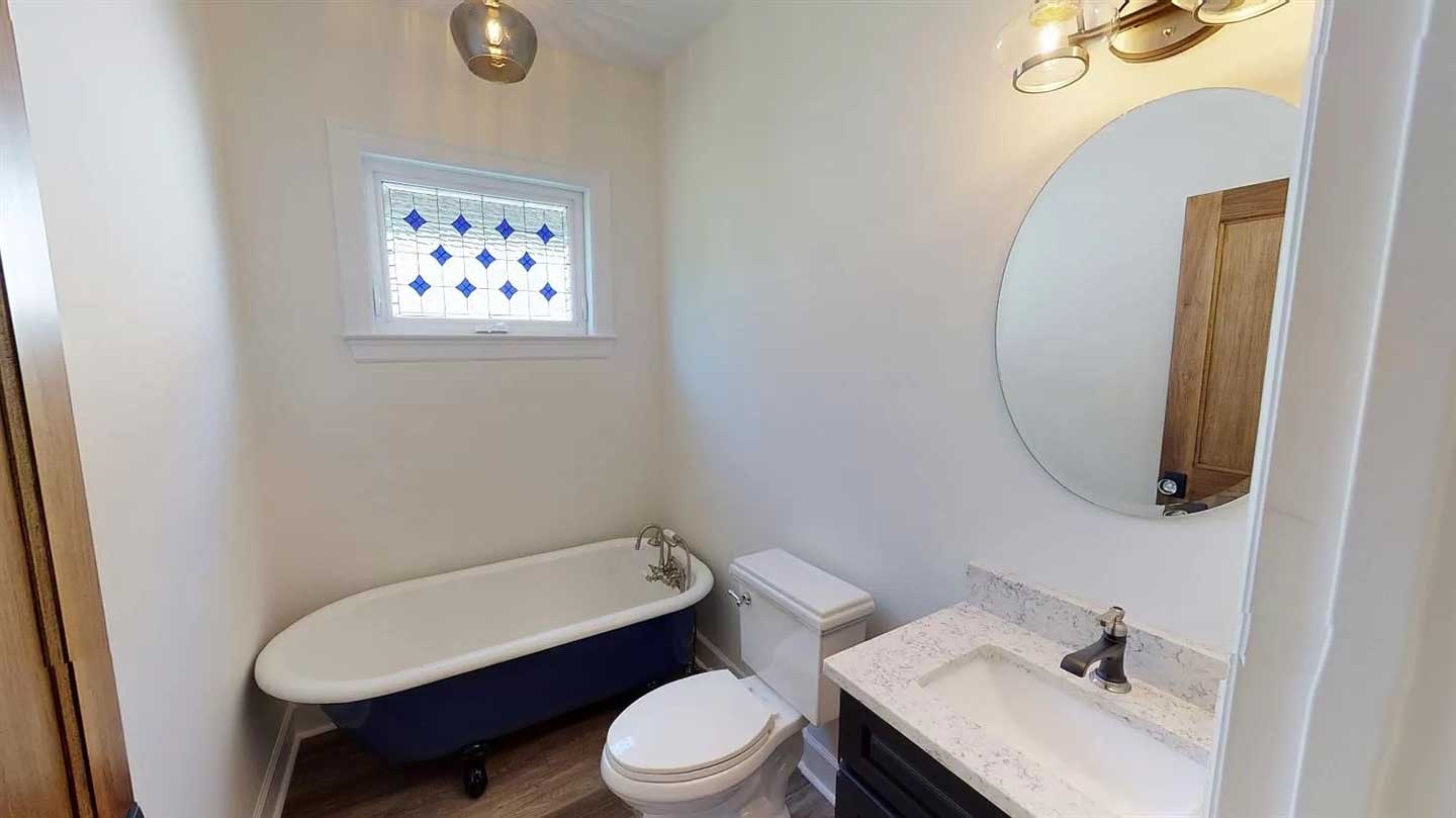 Stained Glass Window installed over a bathtub